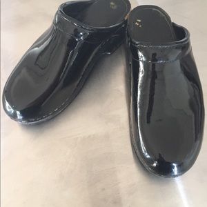 Black patent leather clogs